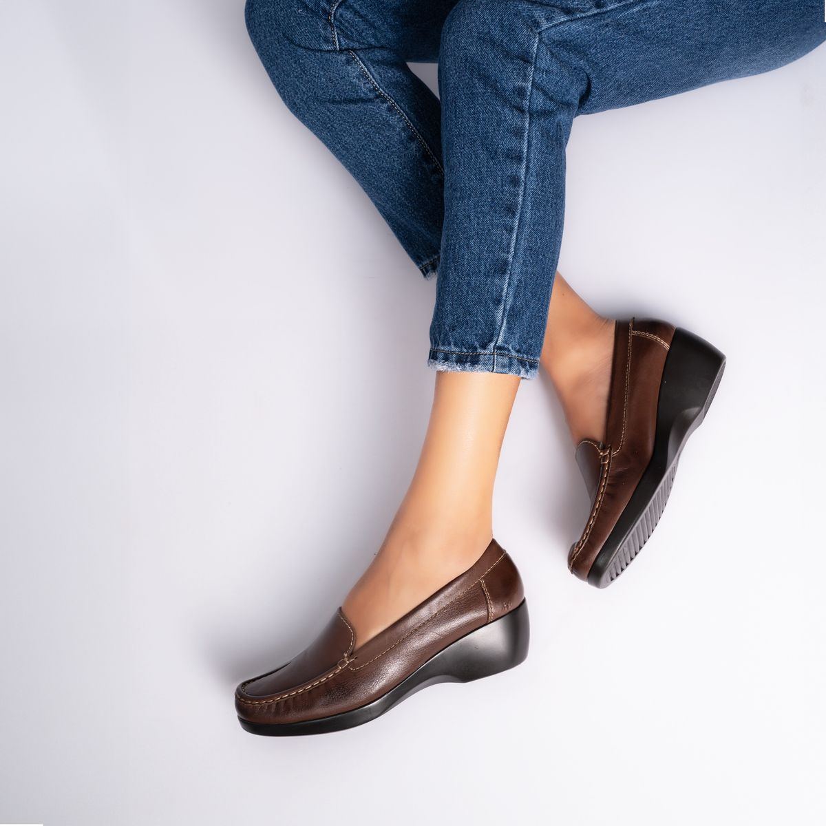 Stylish brown loafers paired with denim for casual everyday wear
