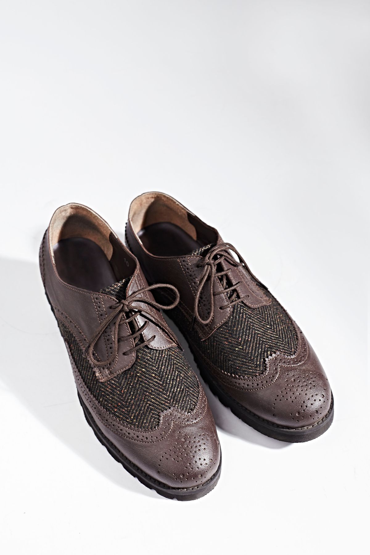 Close-up of stylish brown leather Oxford shoes