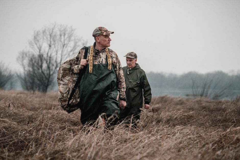Two hunters together in the field representing TideWe founders Jason and Peter who built the brand for real-world hunting conditions